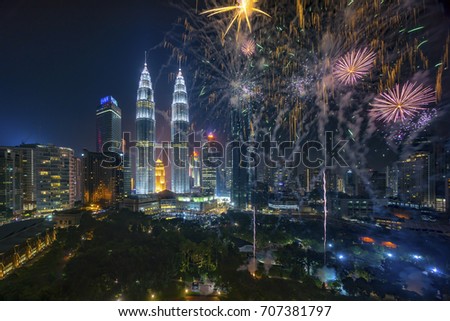 Fireworks display show over Kuala Lumpur city skyline Royalty-Free Stock Photo #707381797