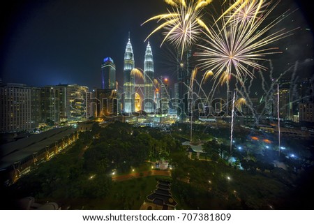Fireworks display show over Kuala Lumpur city skyline Royalty-Free Stock Photo #707381809