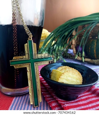 Christ cross with bread, close up glass of grape wine, still life picture indicated symbol to Mass worship of christian, selective focus