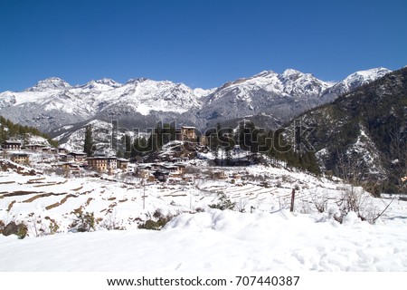 Beautiful snow view of little village in valley with blue sky at Thimpu, Bhutan