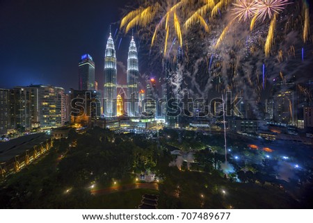 Fireworks display show over Kuala Lumpur city skyline Royalty-Free Stock Photo #707489677