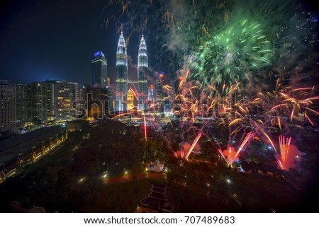 Fireworks display show over Kuala Lumpur city skyline Royalty-Free Stock Photo #707489683