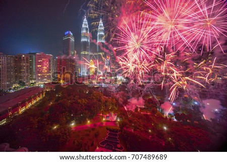 Fireworks display show over Kuala Lumpur city skyline Royalty-Free Stock Photo #707489689