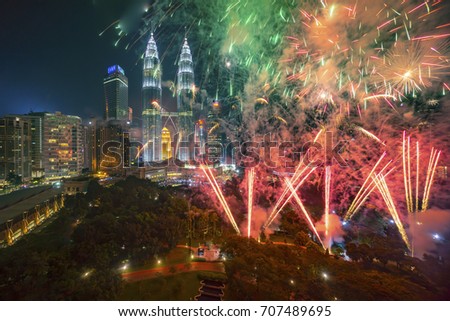 Fireworks display show over Kuala Lumpur city skyline Royalty-Free Stock Photo #707489695