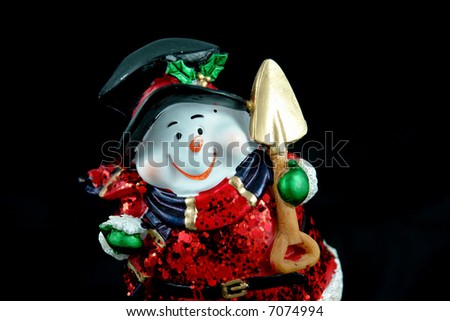          A picture of a funny Snow Santa Claus with shovel