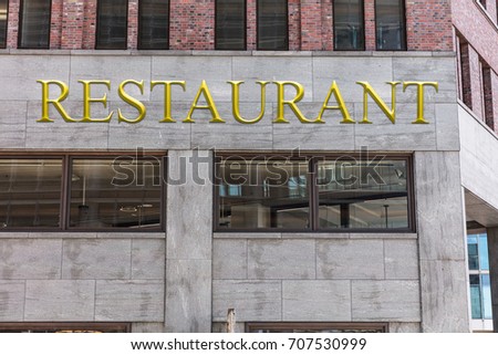 Low angle view of modern restaurant building in city