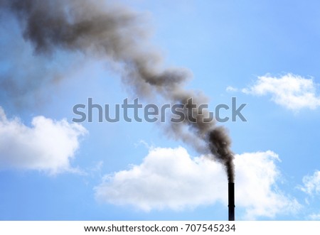 Smoke emission against blue sky. Air pollution concept