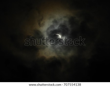solar eclipse in lincoln nebraska through the clouds 2
