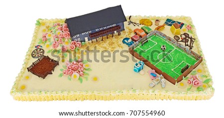 Funny and lovely sporty cake isolate on white background. design With the football Field. shoes, building, farm, flowers, sport day. white cake, cream. green Field. birthday cake for a sport team. 
