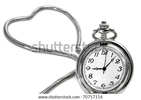 isolated pocket watch with the chain forming a heart