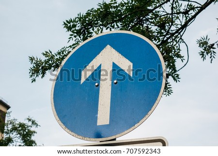 traffic sign with white arrow