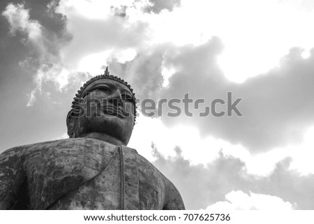 Statue of Buddha, the sky is bright, Mukdahan Province, Thailand.black and white picture.