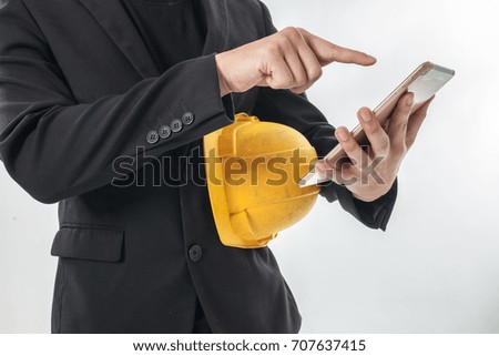 Construction supervisor business man write and read email in his phone on white background 