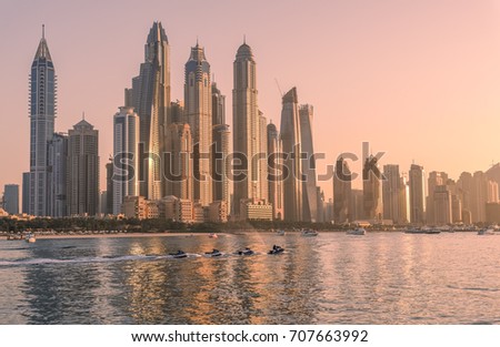 Dubai Marina skyscrapers view and bay at sunset