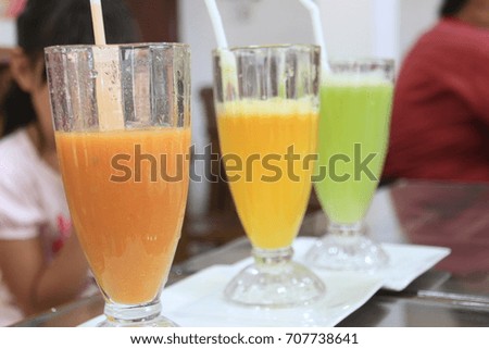 Three colors tropical fruits juices in a south countries bar.