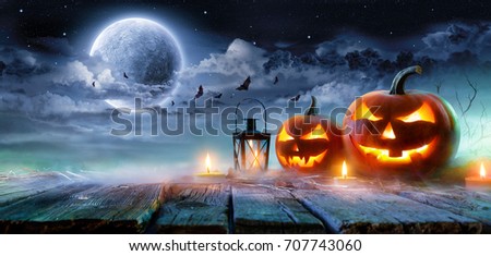 Jack O’ Lanterns Glowing At Moonlight In The Spooky Night - Halloween Scene
 Royalty-Free Stock Photo #707743060