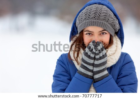 Portrait of a woman feeling cold in winter ? outdoors