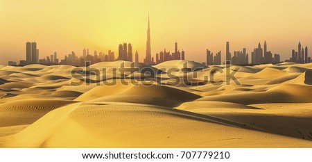 Dubai skyline in desert at sunset. Royalty-Free Stock Photo #707779210