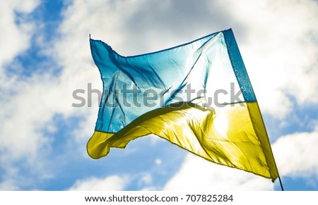 Flag of Ukraine on the background of the blue sky.
