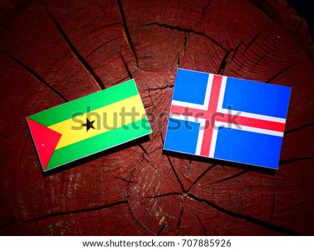 Sao Tome and Principe flag with Icelandic flag on a tree stump isolated