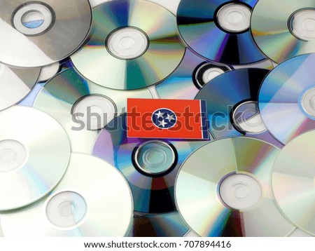 Tennessee flag on top of CD and DVD pile isolated on white