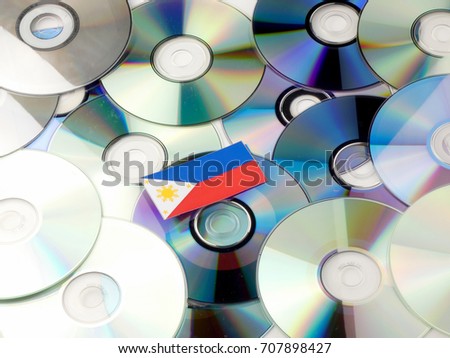 Philippines flag on top of CD and DVD pile isolated on white