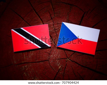 Trinidad and Tobago flag with Czech flag on a tree stump isolated