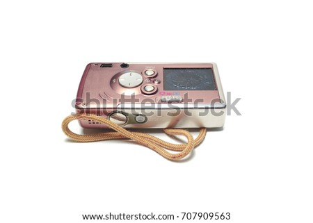 the old brown digital camera with brown strap