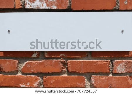 Whiteboard on the brick wall