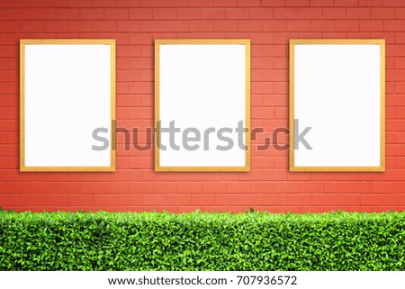 White poster with wood frame mockup on red brick wall. mock up.