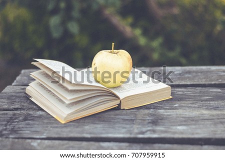 The Apple on the book in the fall