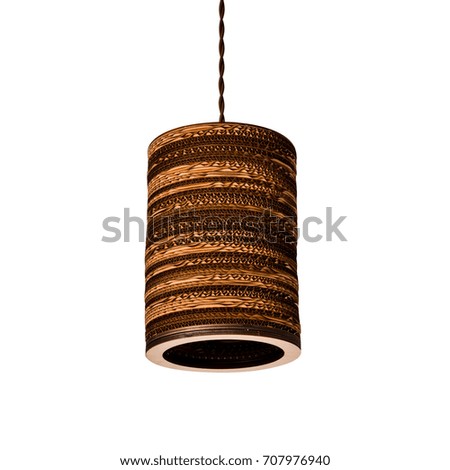 Wooden chandelier in the form of a brown cylinder with an electric cord
