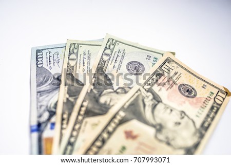 many dollars on a white background isolated. dollar background. background of many US dollars banknotes