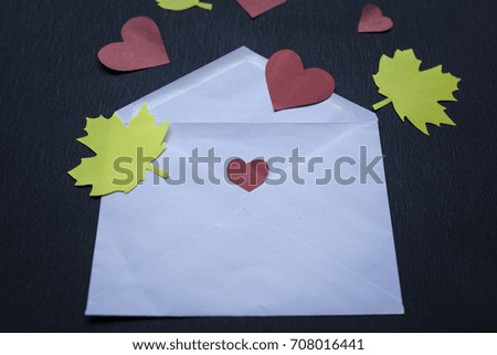 letter with love in black background, gift box, present, fall in love, autumn mood. flat lay, create new ideas, white letter. space for your text