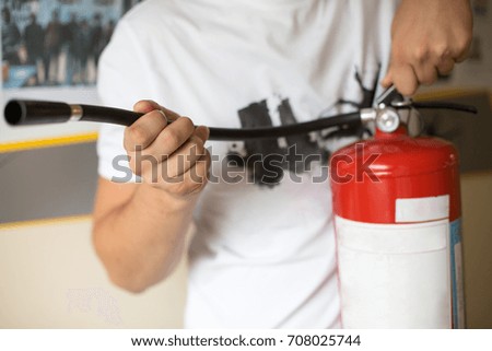 man with a fire extinguisher