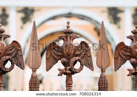 Two-headed eagles on the fence around the pillar of Alexandria, on Palace Square In St. Petersburg