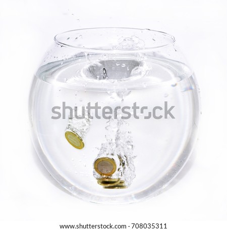 Euro coins in aquarium with water. Isolated on white background.