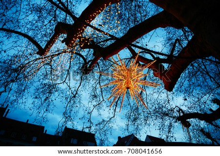 Beautiful glowing star as street Christmas decoration in Strasbourg, Alsace, France