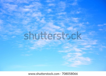 
in the blue sky white soft clouds and abstract background