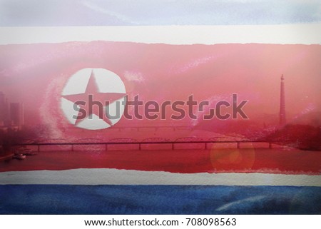 Flag of North Korea against the backdrop of Pyongyang, the capital of North Korea. Combined image with special effects. City from a bird's-eye view.