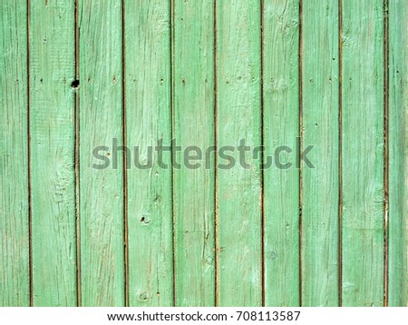 Old plank wooden wall background. The texture of old wood. Weathered piece of wood.
Old rural wooden wall, detailed plank fence photo background. Natural wooden building structure. Painted in green.