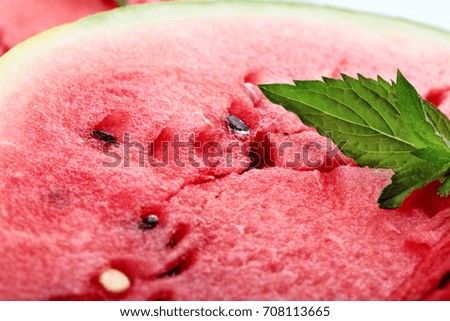Watermelon.Detailed closeup of fresh sweet watermelon with leaf of mint.Big berry.Ripe fruit