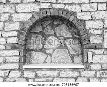 arched frame on stone wall, Black and White 
