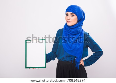 Arabic Muslim beautiful woman holding banner for your text