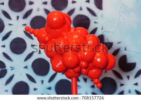 orange abstract object of several balls represents foam from bubbles