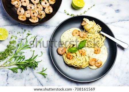 Spaghetti with shrimps twirled on fork
