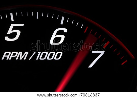 Close up on a tachometer reaching maximum engine speed Royalty-Free Stock Photo #70816837