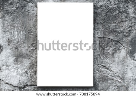 Vertical white empty blank canvas or sheet mockup on city concrete wall