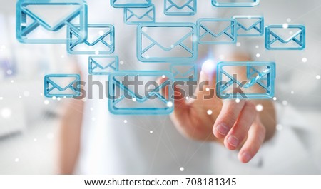 Businessman on blurred background holding and touching floating emails 3D rendering