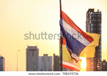 Thai flag with high rise buildings as background